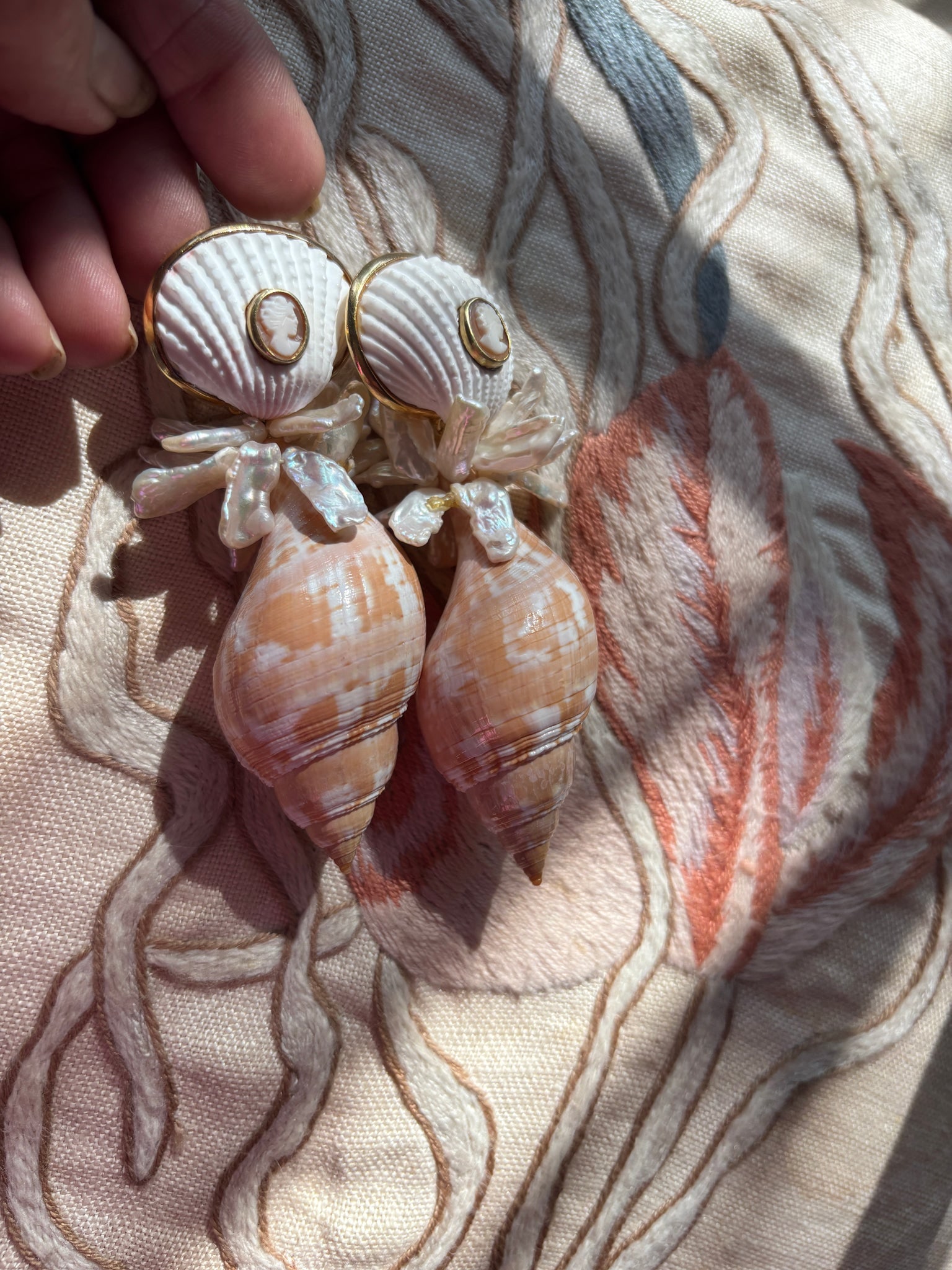 Tulip Shell Earrings with Pearl & Cameos: Title:Tulip Shell Earrings with Pearl & Cameos Description:Fun and showy, these big Tulip shells are light as air. Cheery Keisha Pearls and Cameos added - Signed CSS Vermeil - 3" Drop - Post/Clip Back