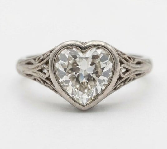 Antique Bezel Set Solitaire with Filigree Heart Shape 2 ct Lab-Grown Diamond Ring in 14K White Gold: Title: Antique Bezel Set Solitaire with Filigree Heart Shape 2 ct Lab-Grown Diamond Ring in 14K White Gold Description: This refined antique bezel set solitaire with filigree ring features a 2 ct lab-