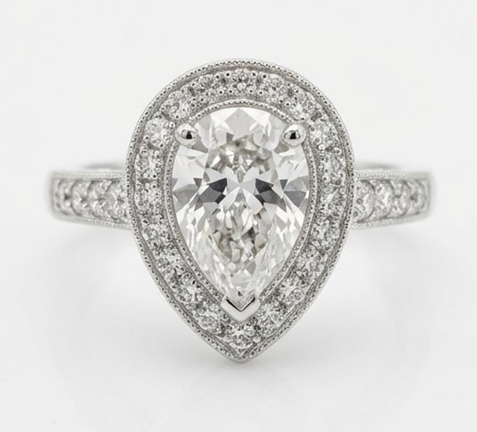 Classic Halo with Pave Band & Milgrain Pear Shape 5 ct Lab-Grown Diamond Ring in 14K White Gold: Title: Classic Halo with Pave Band & Milgrain Pear Shape 5 ct Lab-Grown Diamond Ring in 14K White Gold Description: This refined classic halo with pave band & milgrain ring features a 5 ct lab-grown d