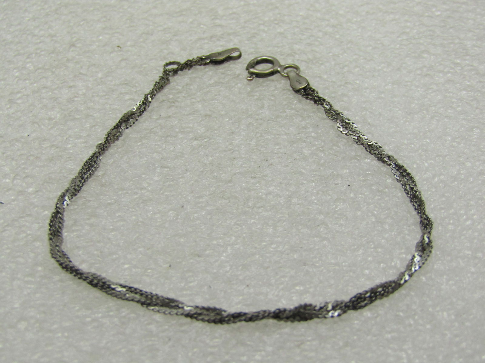 Vintage Sterling Silver Braided Bracelet, 7": Vintage Sterling Silver Braided Bracelet, 7" and appx 2.11 grams. Four S-link herringbone style chain braided. Marked. .925 and tested. Weight is appx. 2.11 grams. Also marked Italy. Age is appx. 1970