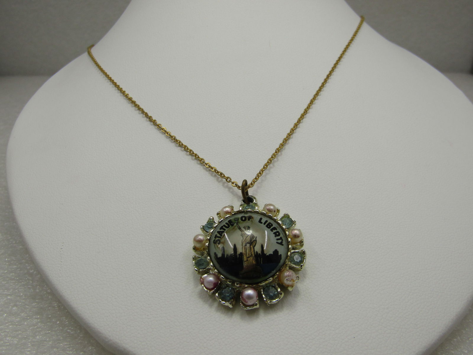 Vintage Statue of Liberty Souvernir Necklace, 17.75", 1950's-1960's: Vintage Statue of Liberty Souvernir Necklace, 17.75", 1950's-1960's. Pendant has a domed image of the New York City skyline in the background with the statute of liberty in the foreground and the