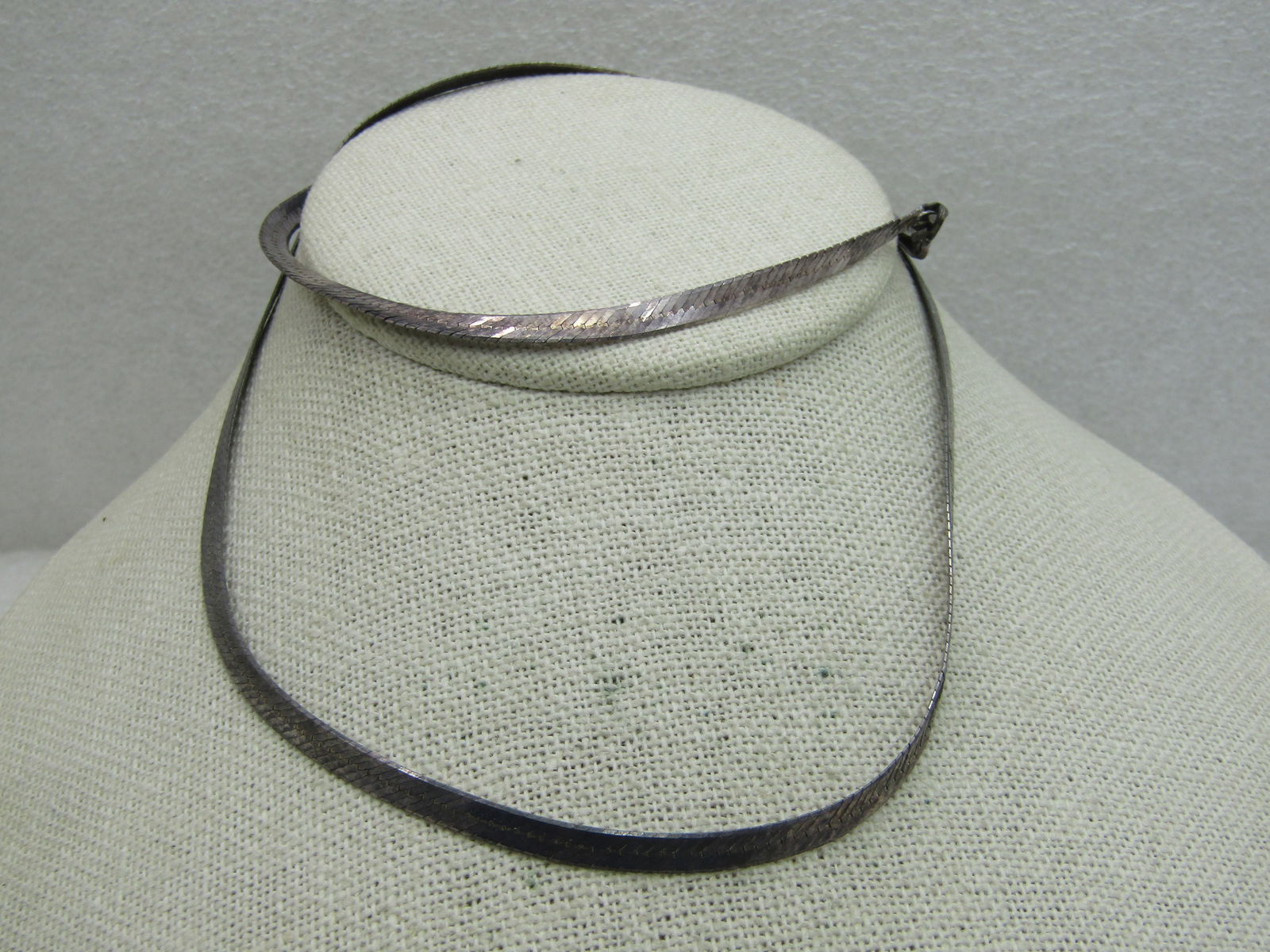 Vintage Sterling Silver Herringbone Necklace, 24" 4mm: Vintage Sterling Silver Herringbone Necklace, 24" 4mm , weight is appx. 11.85 gr., marked Italy and .925 and tested. Lobster clasp. 1980's-1990's. Good condition with oxidation that can be polished to