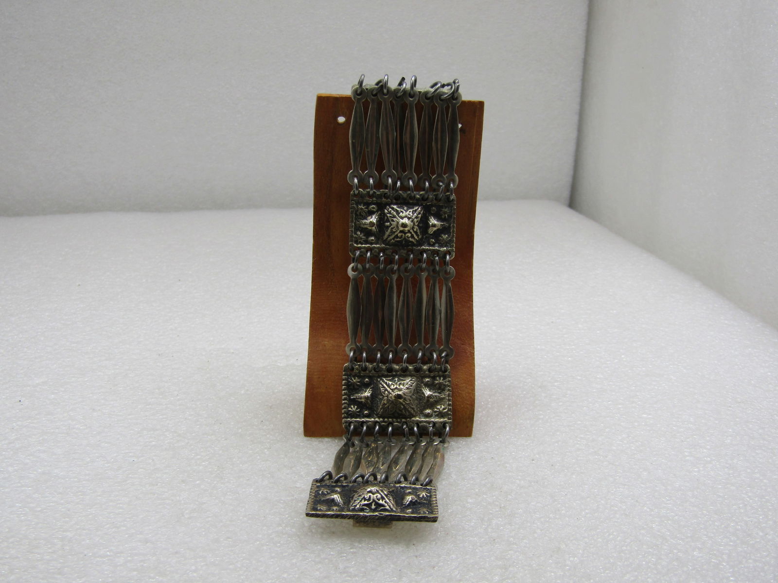 Vintage Mexican Aztec Themed Wide Bracelet, 7.5" Signed Taxco: Vintage Mexican Aztec Themed Wide Bracelet, 7.5" Signed Taxco Mexico at the hook clasp. Appx. 1.25" wide at the heavy aztec pyramid style links that have 8 blade like links between each of these pyram