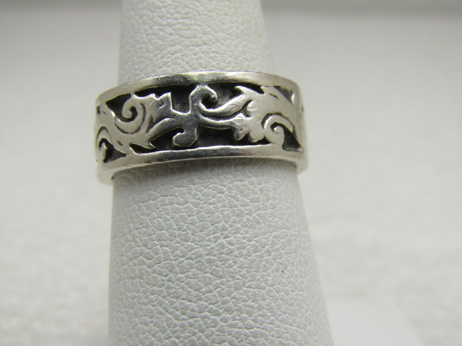 Vintage Sterling Scrolled Repousse Band Ring, Sz. 6.5, 7.5mm Wide: Vintage Sterling Scrolled Repousse Band Ring, Sz. 6.5, 7.5mm Wide , Blacked background with raised repousse design of scrolls - like dragon breath or waves going around the band. Marked .925. Not sign
