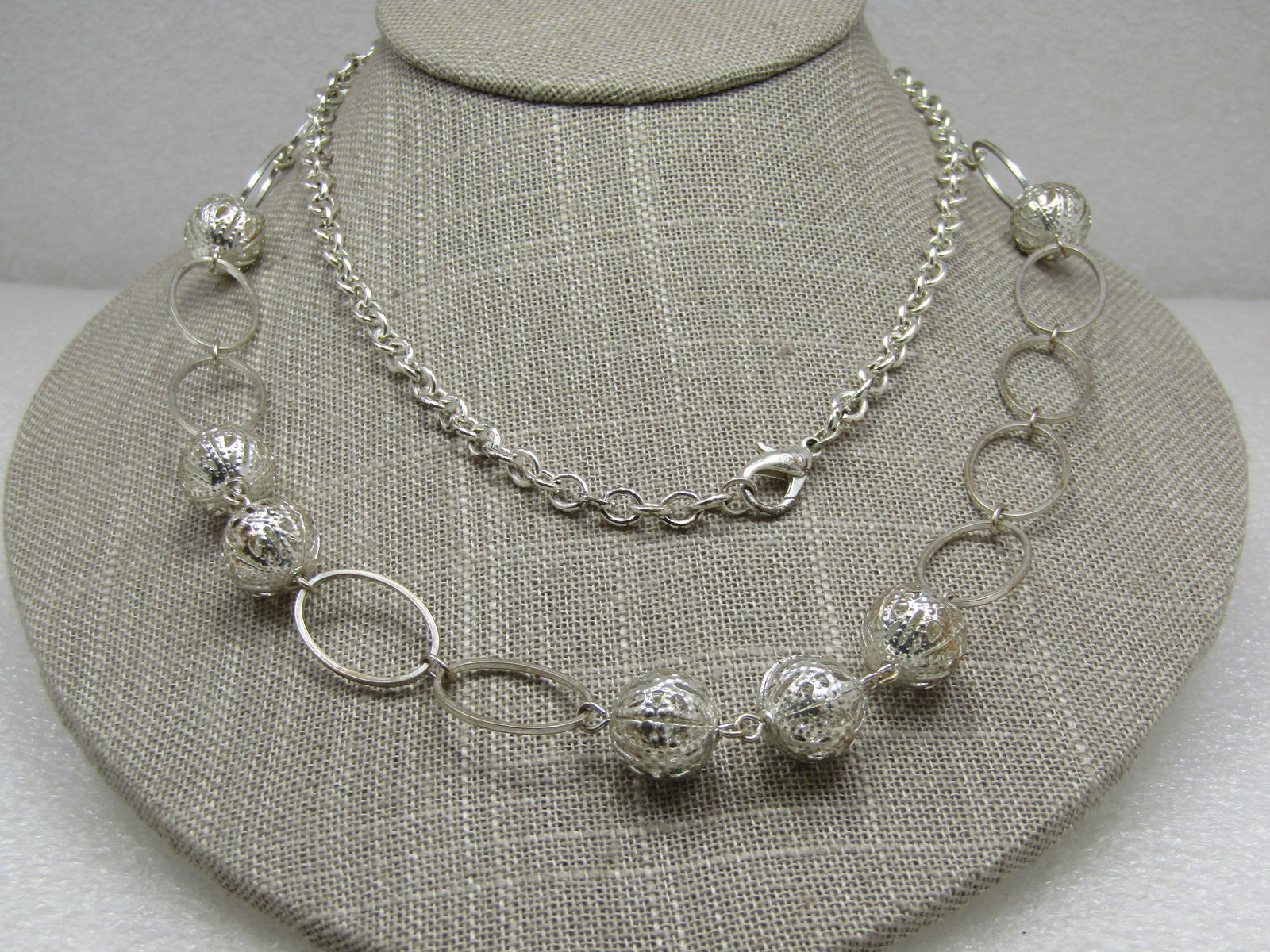 Vintage Filigree Beaded Necklace, 34" Silver Tone: Vintage Filigree Beaded Necklace, 34" Silver Tone. This has a rolo style link at the back nearly have of the necklace with oval open links ansd 12mm filigree round beads, grouped in single beads, doub