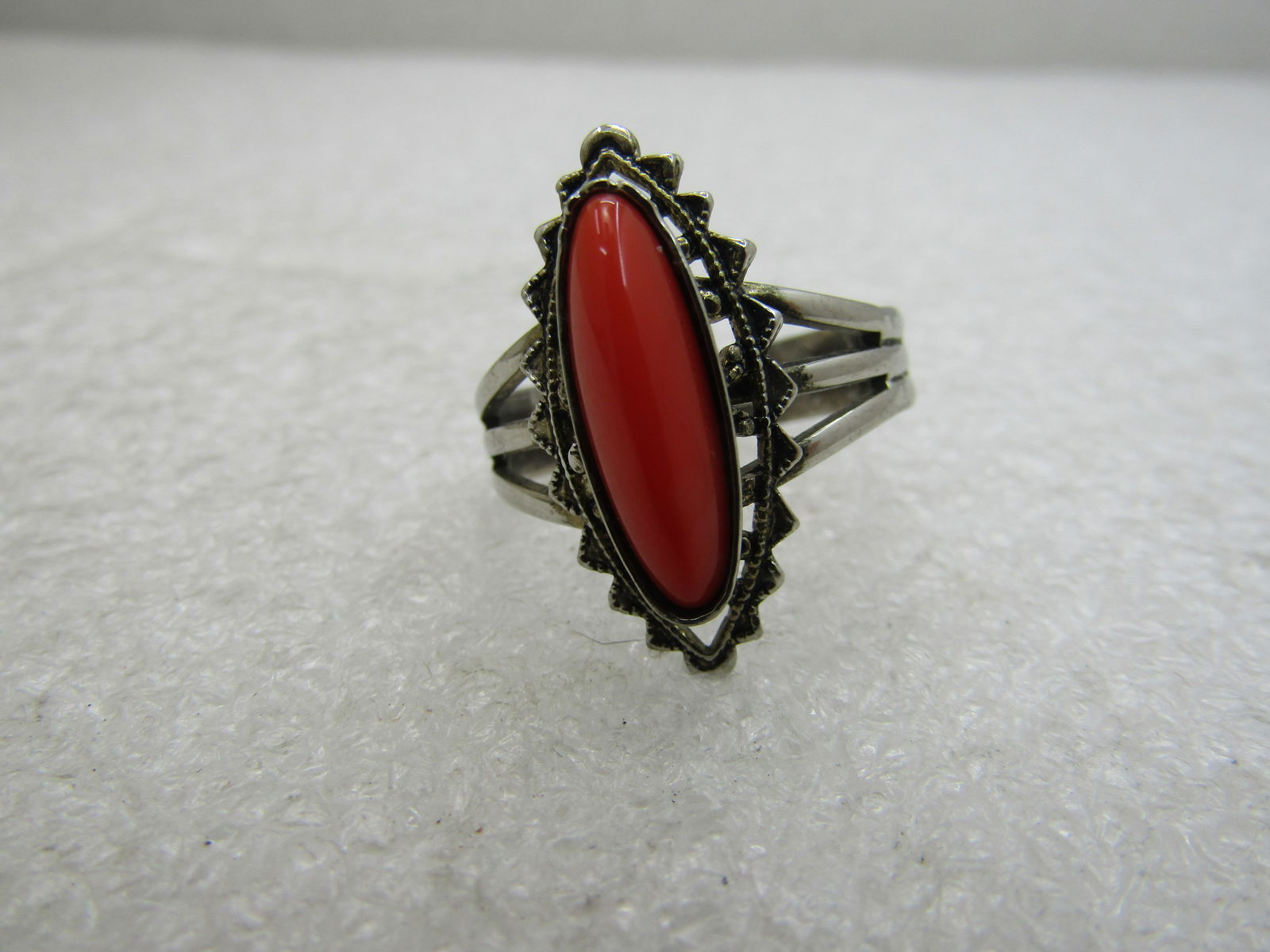 Southwestern Faux Coral Ring, Adjustable, Sz. 6-9: Southwestern Faux Coral Ring, Adjustable, Sz. 6-9, nice costume southwestern pointed filigree ring with triple band at top and fusing into a ridge band. The ring is 1" down the finger and 1/2" acorss