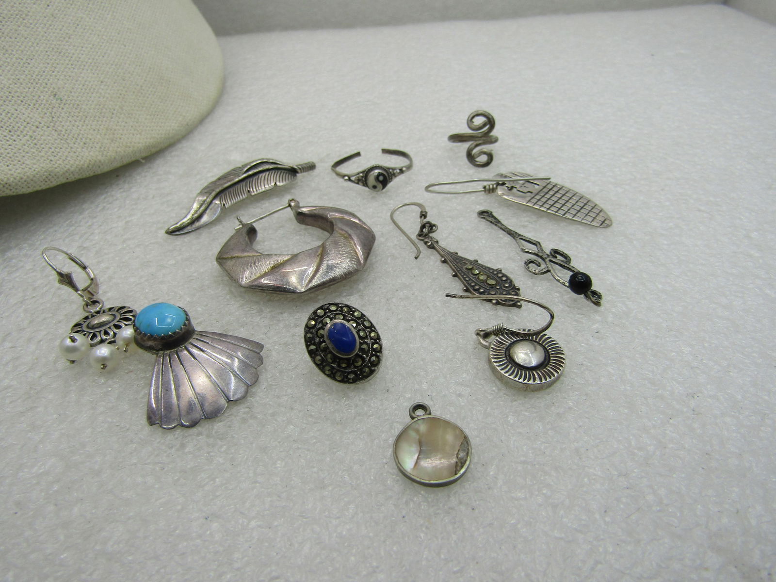 12 Sterling Pieces, Single Earrings, Dangles, more. 25.49 grams: 12 Sterling Pieces, Single Earrings, Dangles, more. 25.49 grams, 7 single earrings, turquoise southwestern, southwestern, drop, sunlike drop, faux pearl dangle leverbck, lapis lazuli marcasite stud ,
