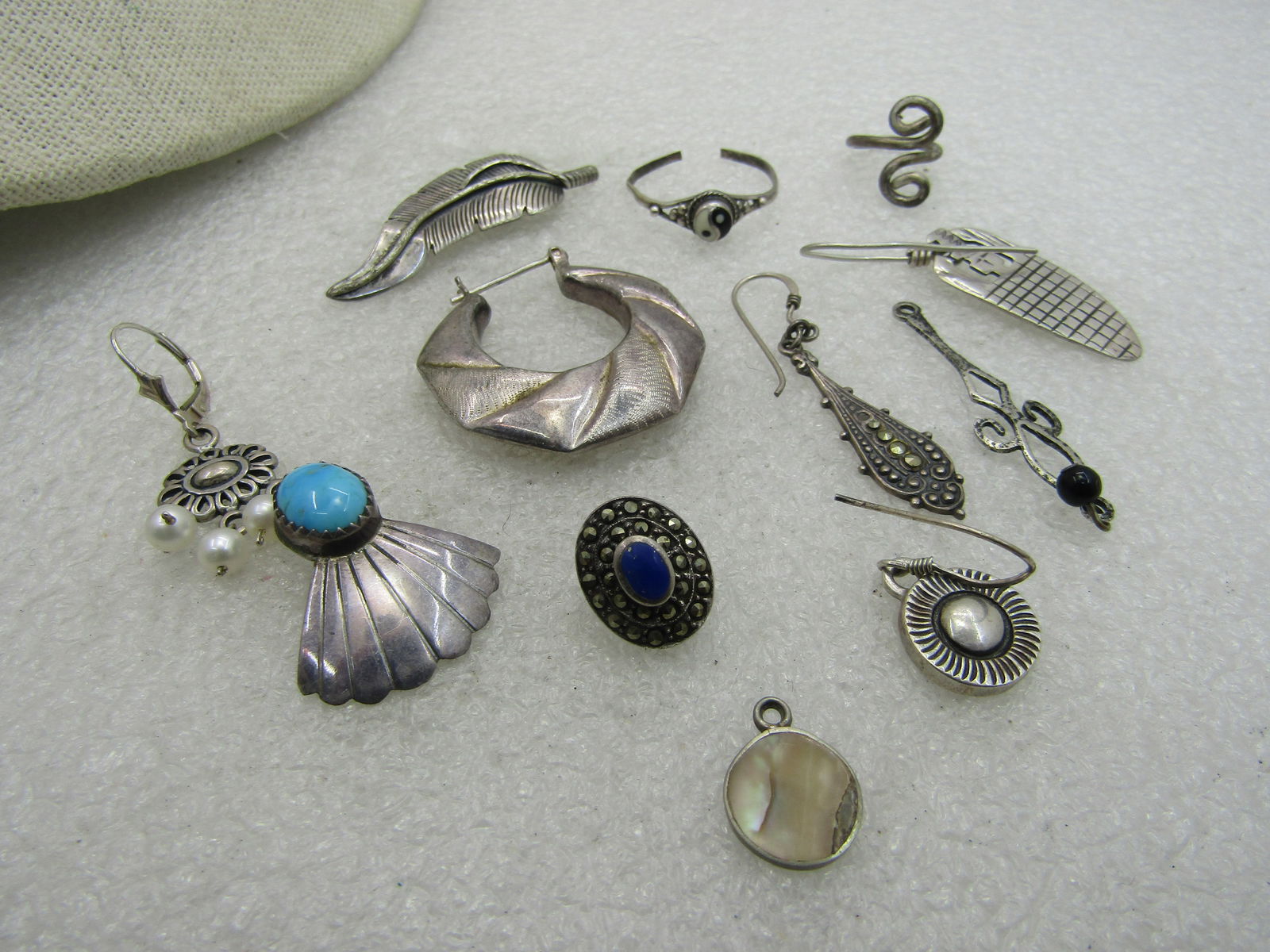 12 Sterling Pieces, Single Earrings, Dangles, more. 25.49 grams - 2