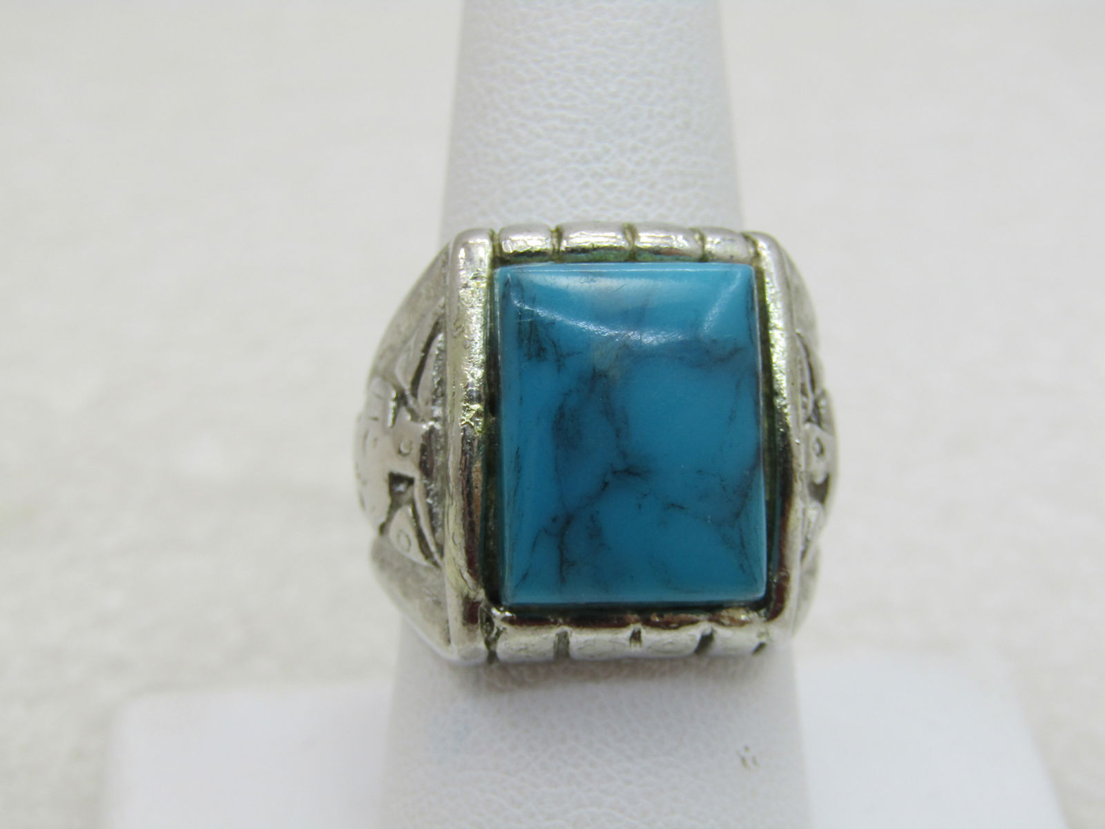 Vintage Southestern Faux Turquoise Ring, Sz 9, Silver Tone (NL): Vintage Southestern Faux Turquoise Ring, 1960'S-1970'S, Sz 9, Silver Tone (NL)/ thunderbird design on the side shoulders of the ring, the ring is appx. 20mm down the finger and is appx. 4mm at the bck