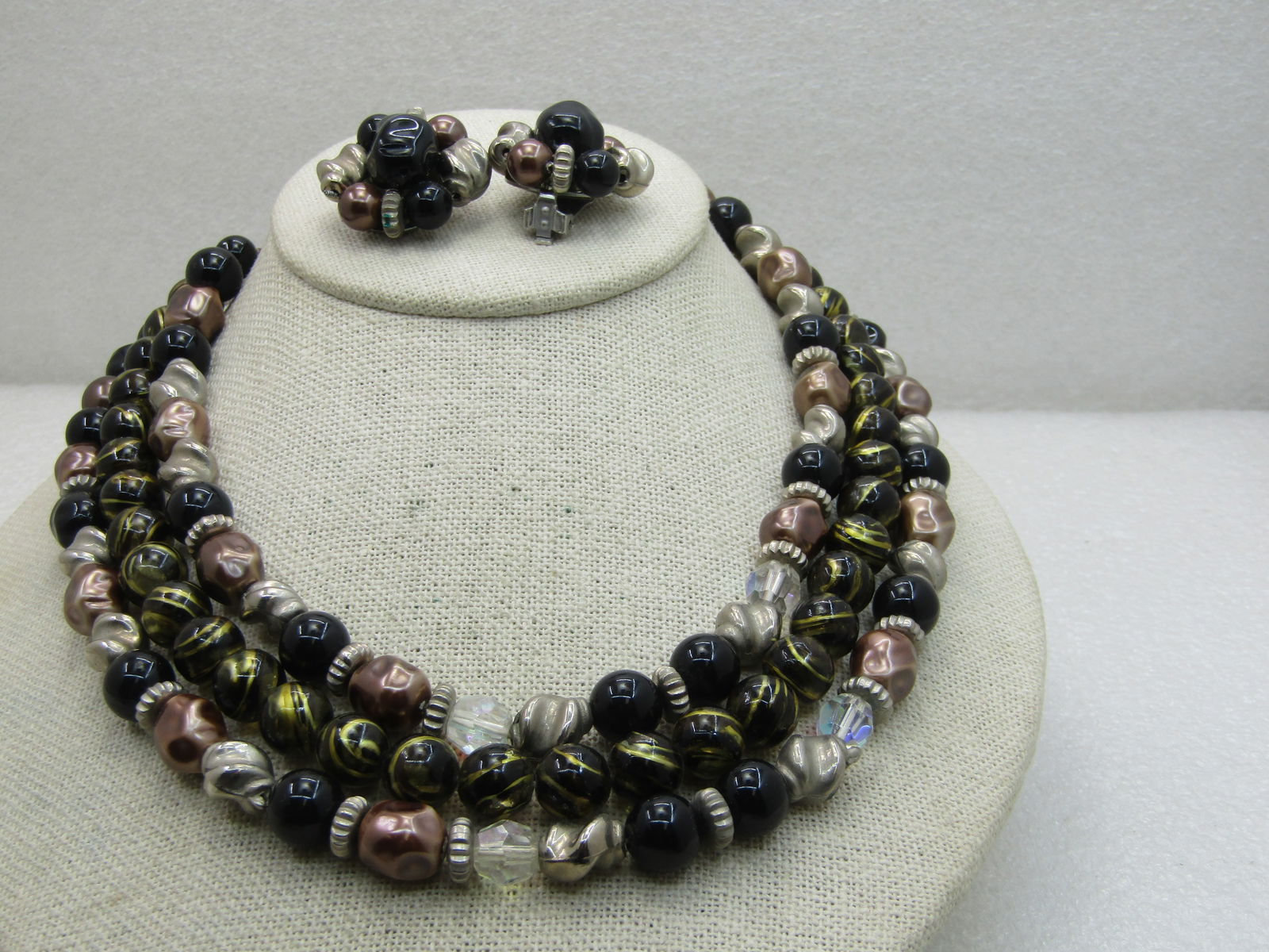 Vintage Black, Gold Beaded Multi-Strand Necklace Earrings Set, 17", 1950's-1960's: Vintage Black, Gold Beaded Multi-Strand Necklace Earrings Set, 17", 1950's-1960's, triple strand of black round 10mm beads and a mix of metallic nugget beads and gold tone twisted beads with faceted c