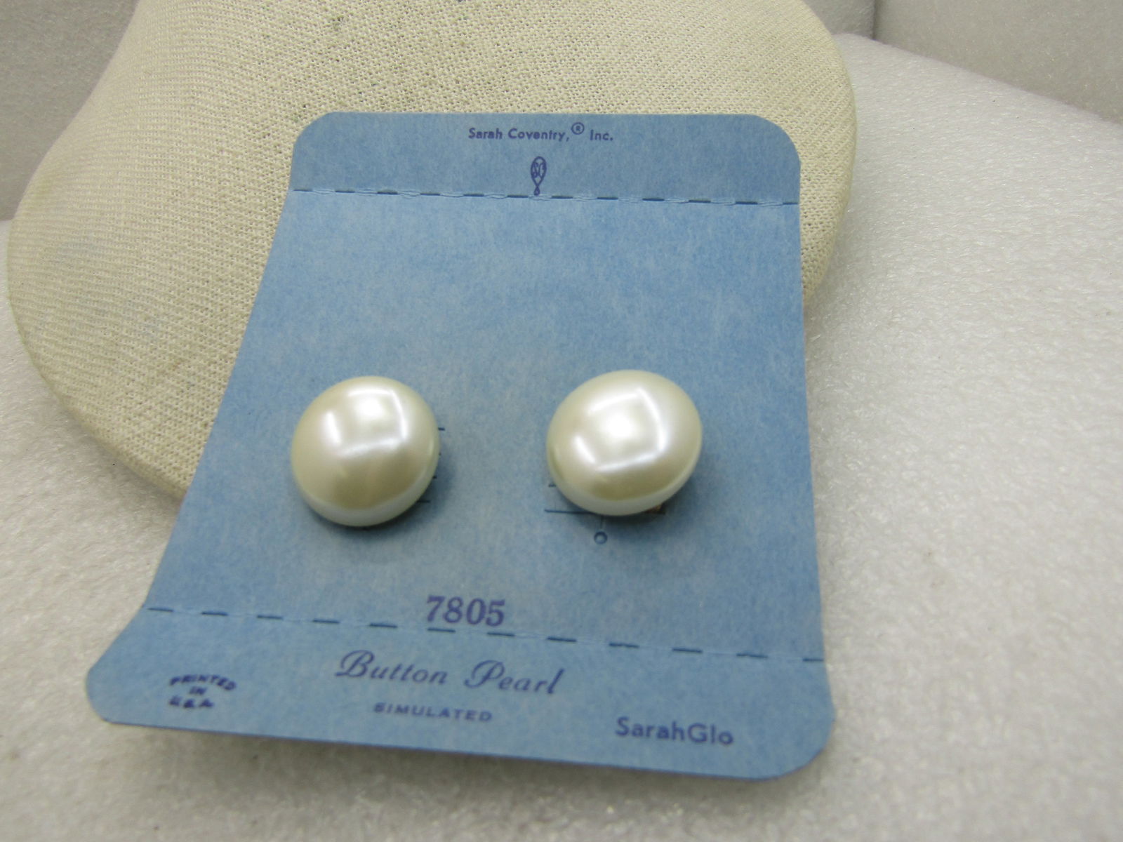 Vintage Sarah Coventry Faux Pearl Clip Earrings, on original card: Vintage Sarah Coventry Faux Pearl Clip Earrings, on original card, No. 7805 , 3/4" faux button stud clip earrings. 1960's-1970's vintage new. Very good condition. (INV. W.3720.5, SS1073 Nl LD 4/10/20)
