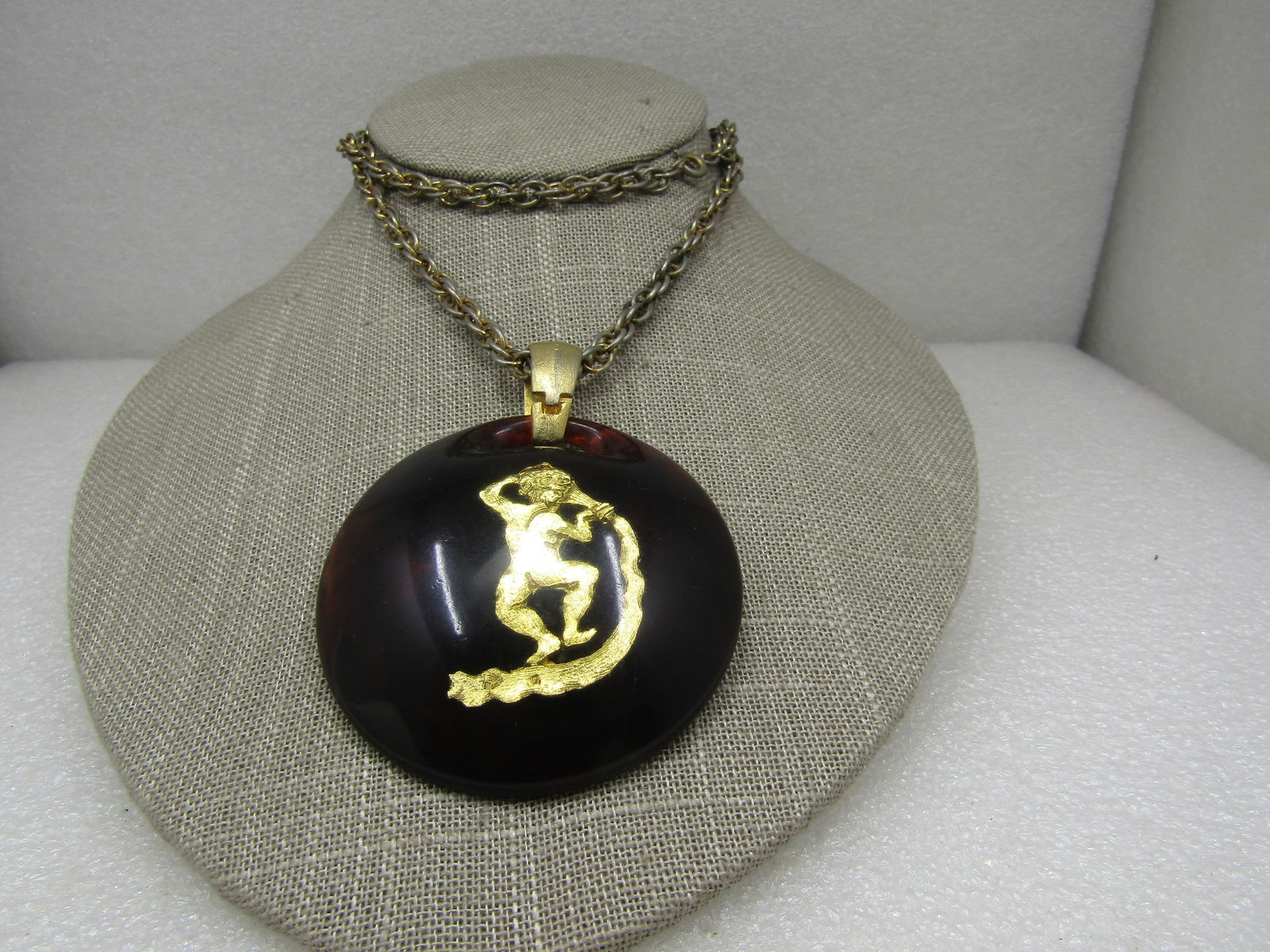 Vintage Sagittarius Faux Tortoiseshell Domed Necklace, 22", 1960's: Vintage Sagittarius Faux Tortoiseshell Domed Necklace, 22", 1960's. The pendant is 2.5" across from side-to-side. The pendant with the bail is appx. 3". Gold tone brushed finish bail and gold tone Sag