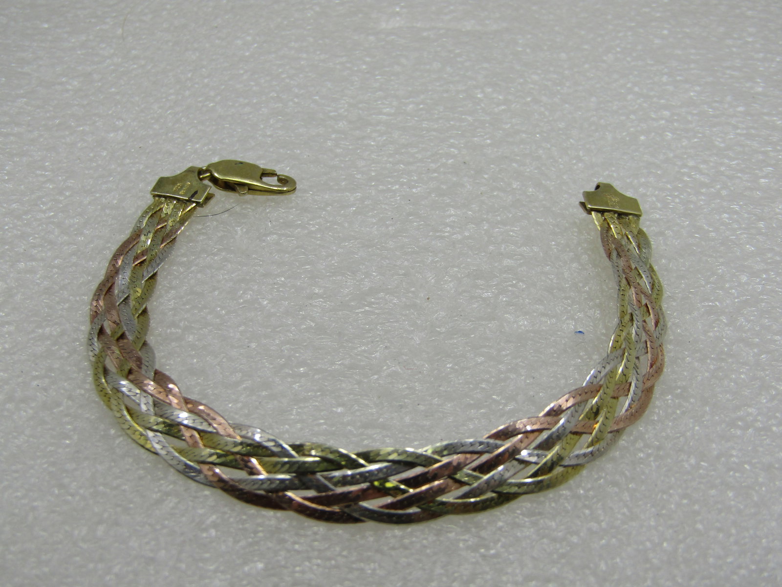 Sterling Silver Tri-Color Braided Herringbone Bracelet, 7", Signed FMC, 9mm: Sterling Silver Tri-Color Braided Herringbone Bracelet, 7", Signed FMC, 9mm. Signed FMC and Italy and .925. 5 strands braided - rose, yellow gold over sterling and sterling strands. Weight is appx. 8.