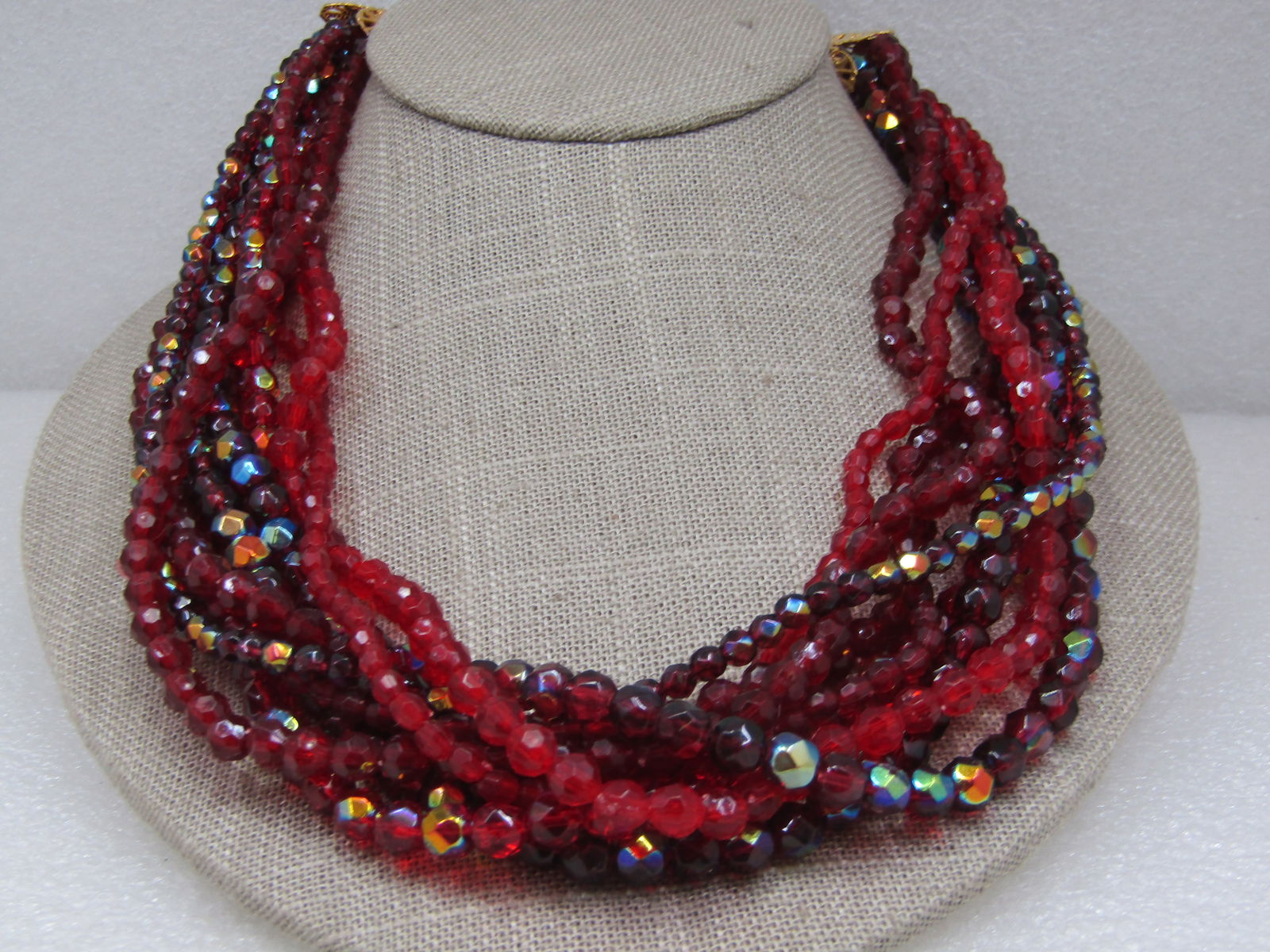 Vintage Red Beaded Torsade Necklace,20", Aurora Borealis: Vintage Red Beaded Torsade Necklace,20", Aurora Borealis on some of the beds, a mis of sizes and shades, all faceted acrylis beads from 3.5mm to 6.5mm. Filigree end caps with an extender chain which i