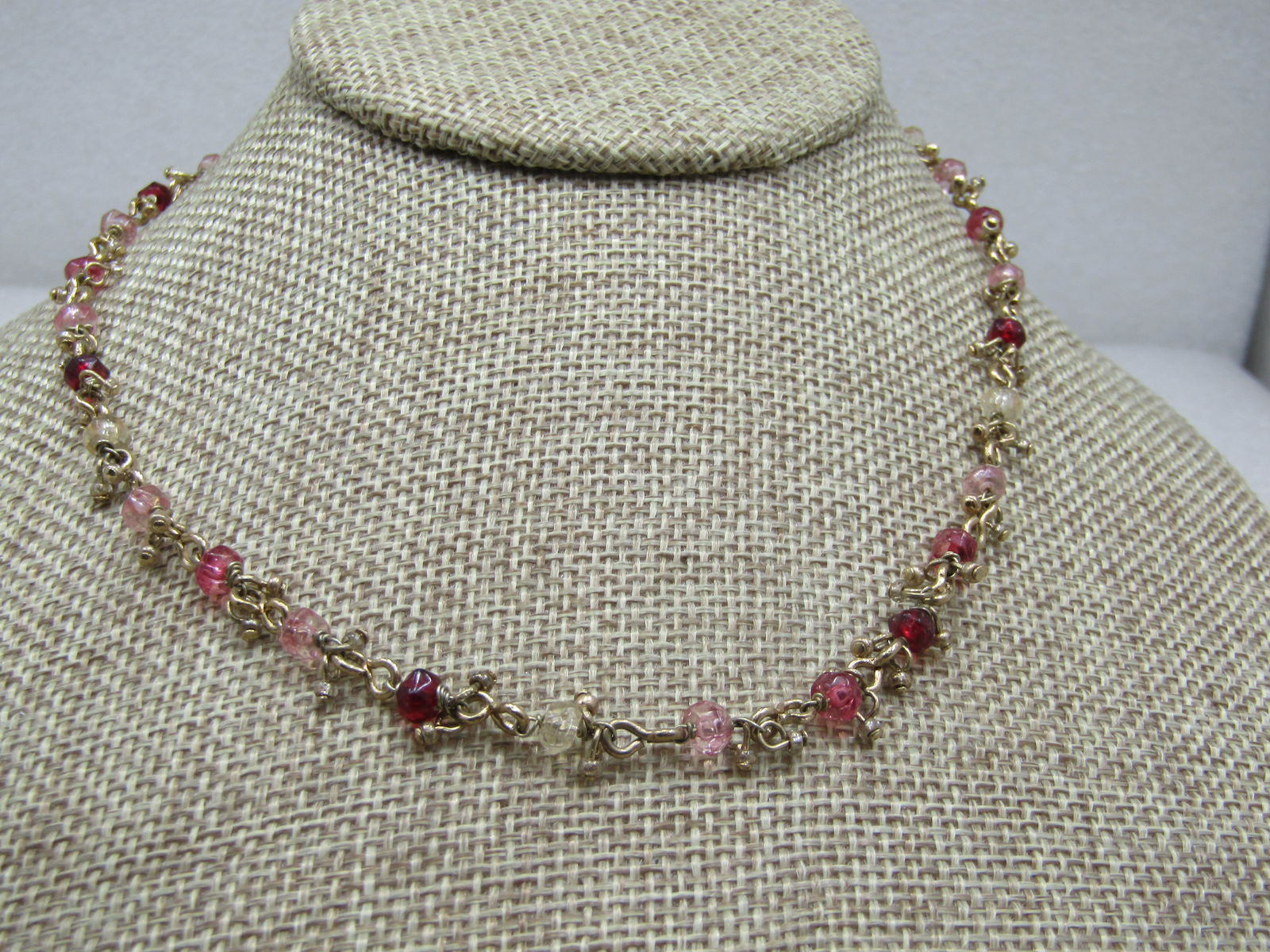 Liz Claiborne Rhinestone Dangle Necklace, 19": Liz Claiborne Rhinestone Boho Dangle Necklace, 19". which includes the extender chain. The necklace is gold tone with slight gold bead drops and faceted pink, red, amber, yellow crystals around the ne