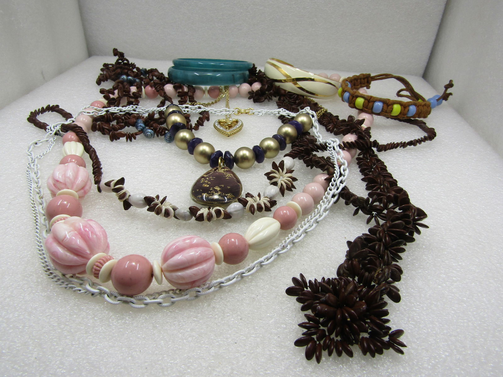 Vintage 11 Pc. Necklace, Bracelet Lot, 1960's-1980's: Vintage 11 Pc. Necklace, Bracelet Lot, 1960's-1980's. Pink and white plastic beaded necklace; three seed-beaded necklace; white enameled multi-strand neck;ace; faux pearl & rhinestone heart locket nec