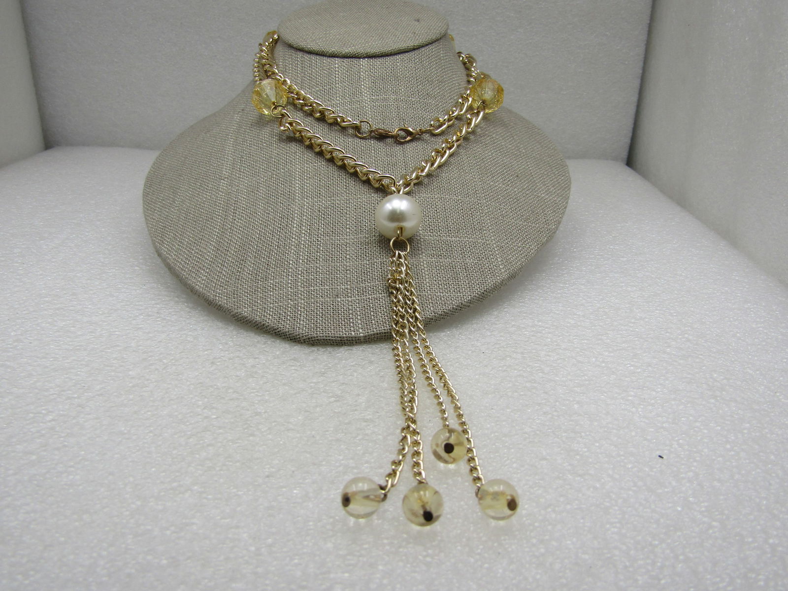 Vintage Faux Pearl Yellow Crackle Tassel Necklace, 28": Vintage Faux Pearl Yellow Crackle Tassel Necklace, 28" with a 15mm white faux pearl at the top of the tassel and that drops measures an additional 5". Gold done, The curb link chain is appx 6.5mm. Ver