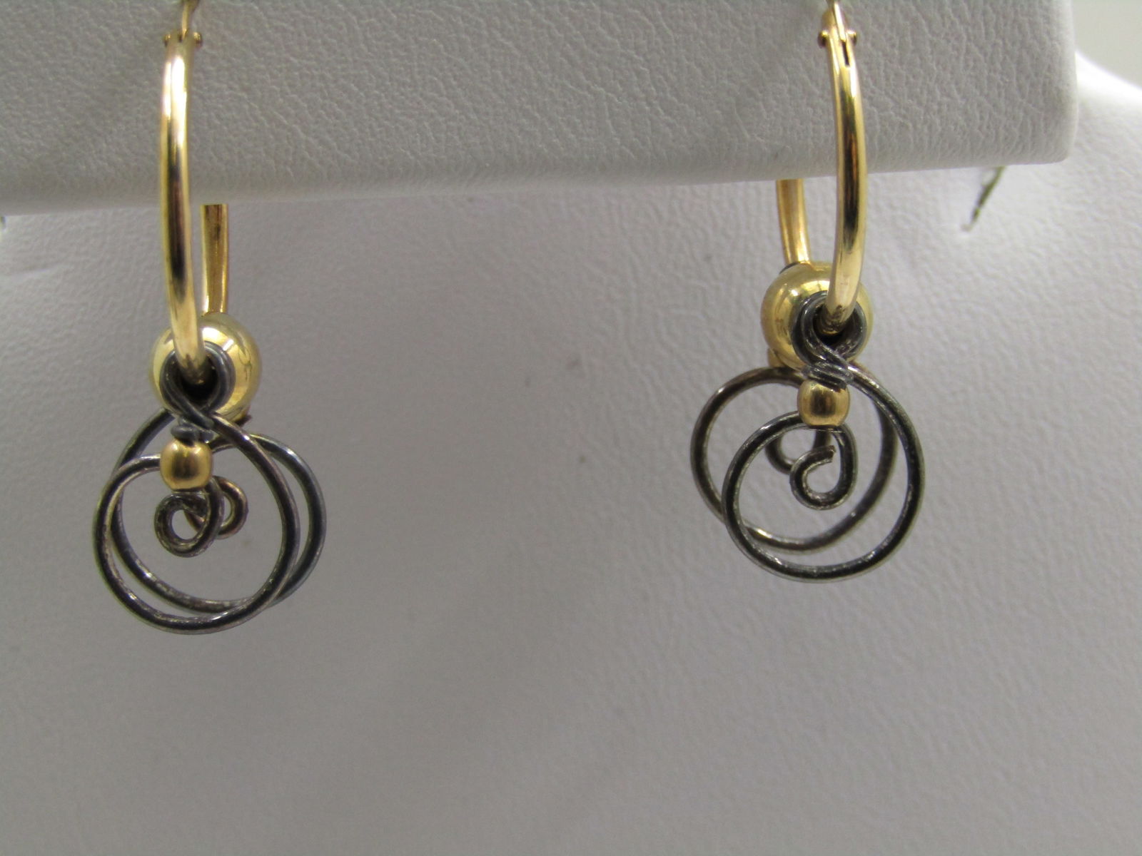 10kt G.F. Sterling Hoop Earrings, Scrolled Dangles, Pierced by Alisa Sickora: 10kt G.F. Sterling Hoop Earrings, Scrolled Dangles, Pierced by Alisa Sickora. Unknown Artisans brand, Alisa Sickora on card. They are 5/8" 10kt G.F. hoop pierced earrings, marked on the post which sna