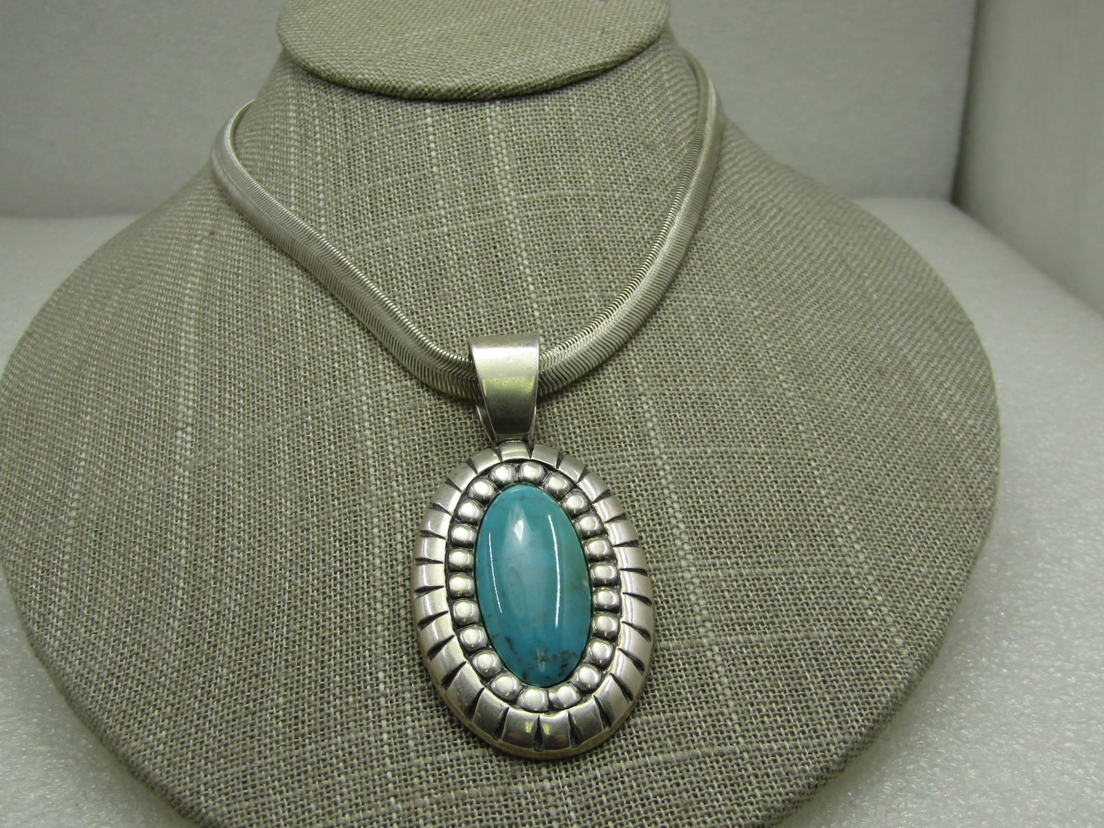Sterling Southwestern Carolyn Pollack Relios Simulated Turquoise Necklace, 18": Sterling Southwestern Carolyn Pollack Relios Simulated Turquoise Eye Necklace, 18" snake chain that is 6mm wide. The pendant has a wide bail with opening of 10.5mm and is 2.5" long and 1.25" wide. The