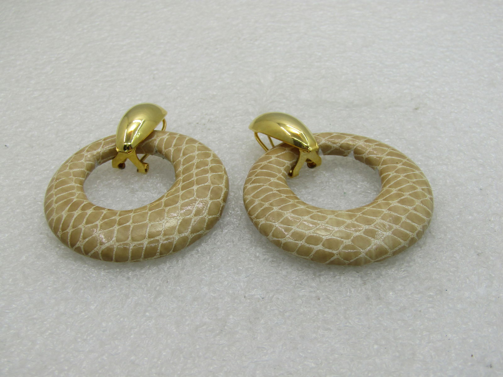 Vintage Faux Leather Large Hoop Earrings 2.25": Vintage Faux Leather Large Hoop Earrings, Pierced. 2.25" by 1.75" wide. Gold tone scooped stud design that the hook slips into - the stud can be worn plain or with the dangle hoops. They are an offset