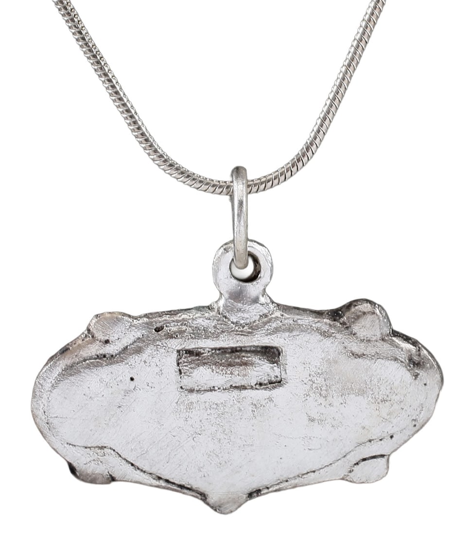 FINE VIKING HEART PENDANT 900-1050 AD: Just under 1 ¼” (1.21”)” width, made by the open face mold method. Broad cusped form with nubs at the quarter points and an incised rectangle above enter. The heart stood for br