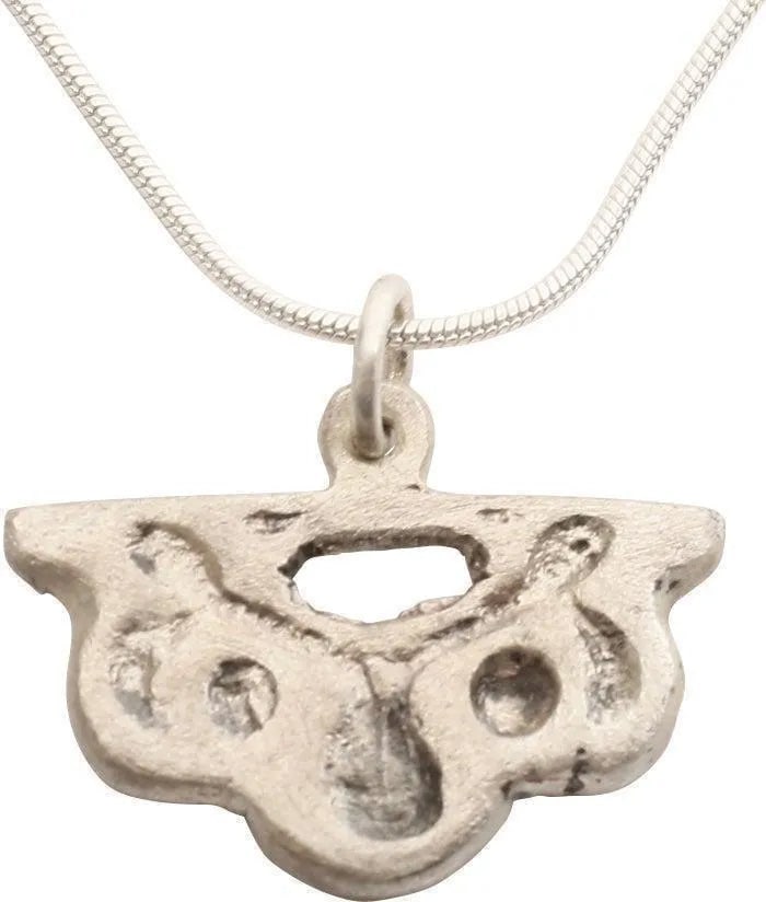 EUROPEAN NOBLE WOMAN'S PENDANT, C.1250-1400: English or French (Norman). Silvered bronze, of broad shield-shape enclosing a stylized heart, a recognition of the earlier Viking form which was still used after conversion to Christianity. An armori