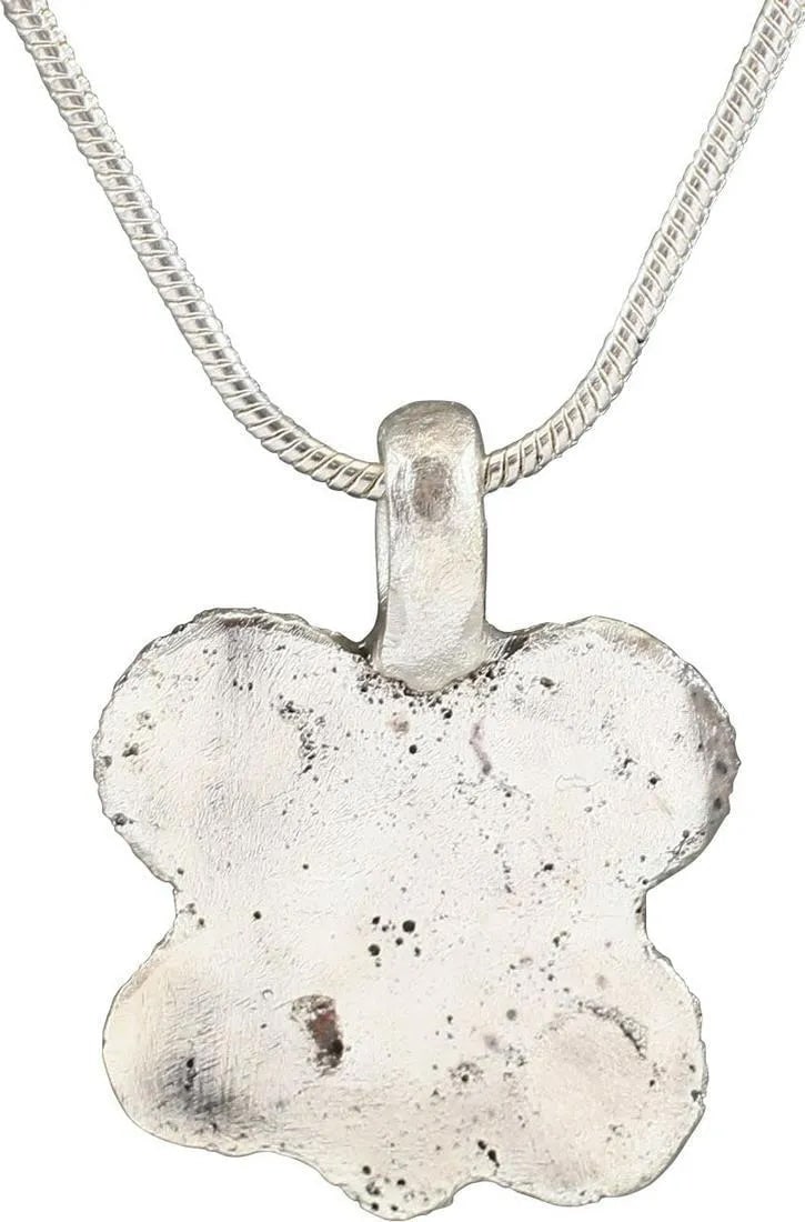 ANCIENT ROMAN QUATREFOIL PENDANT, 1st-2nd CENTURY AD: Silvered bronze. Just under 3/4" height, shaped as a quatrefoil with incised circles to each quarter and a central diamond. Professionally refurbished with the silver overlay restored. On a modern Ste