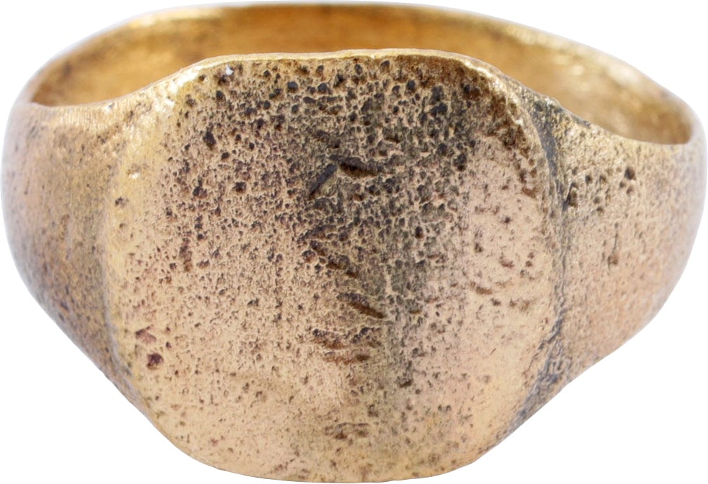 MEDIEVAL MAN’S RING C.6TH-9TH CENTURY AD 9 3/4: Size 9 3/4 with 3.7mm rounded face band. Gilt bronze with rounded bezel suitable for a signet. The shoulders flared. This form is the precursor to the large Viking Warrior rings of the following two c