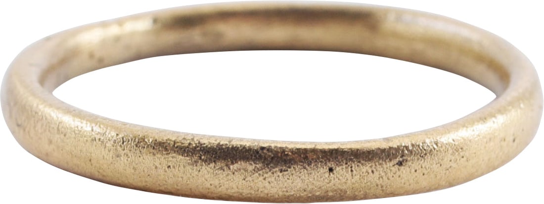 VIKING WOMAN’S WEDDING RING, 9TH-10TH CENTURY AD: Silvered bronze, slightly under size 7 ¼.. 9th-10th Century AD. 2.3mm width band with well rounded face. Professionally refurbished with the 24karat gold surface restored. Vikings exchanged rings
