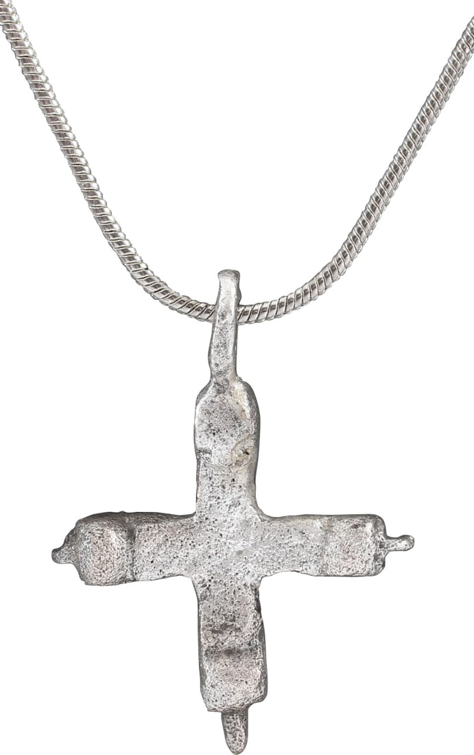 GOOD EUROPEAN CONVERT'S CROSS, C.800-1000 AD: Silvered bronze. Slightly over 1” height. Symmetrical with centered cross beam and beams of identical length. The terminals of each with a lug over a sphere, perhaps a variation of the cross and