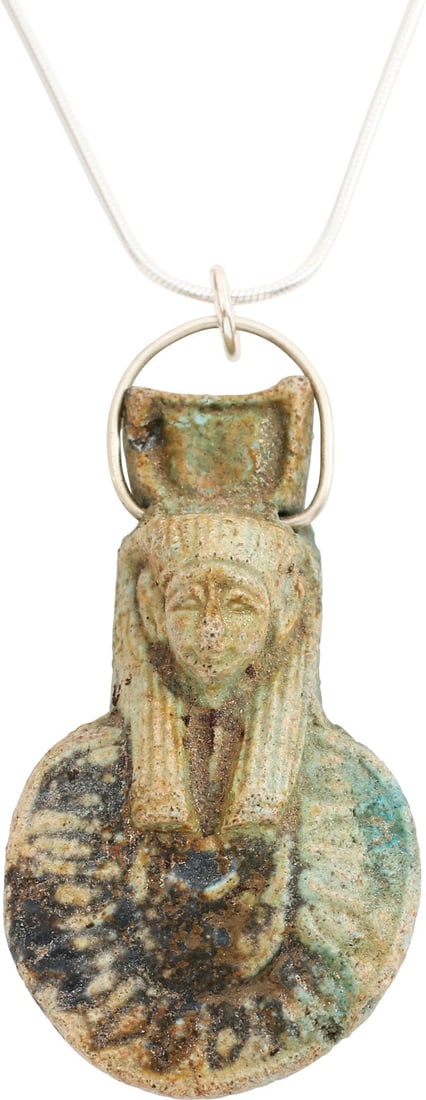 EGYPTIAN GRAND TOUR AMULET, 17th-18th CENTURY: Faience, 1 3/4” height modeled as a pharaoh in desert hood with aegis and solar disk above. These were made in Egypt for sale to primarily English youths who, upon achieving the age of 21,