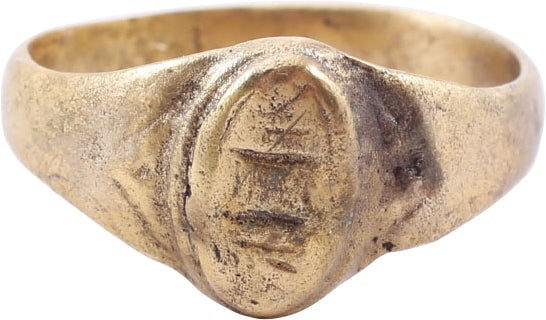 LATE MEDIEVAL WOMAN'S FASHION RING, SIZE 10 ¼: 15th-16th century AD. Women's size 10 1/4. 3.6mm width band with a rounded face, flared to the chevron decorated shoulders. Raised lenticular bezel transversely oriented on beaded base and inscribed w