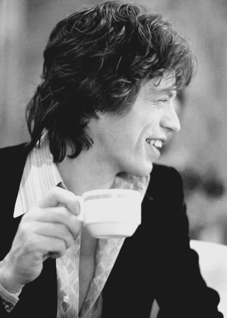 Mick Jagger 1972: 1972 (printed later): Title: Mick Jagger 1972: 1972 (printed later) Description: © Michael Putland Mick Jagger Mick Jagger drinking tea, Cardiff, Wales 1972 Mick Jagger is the iconic lead singer of The Rolling Stones,