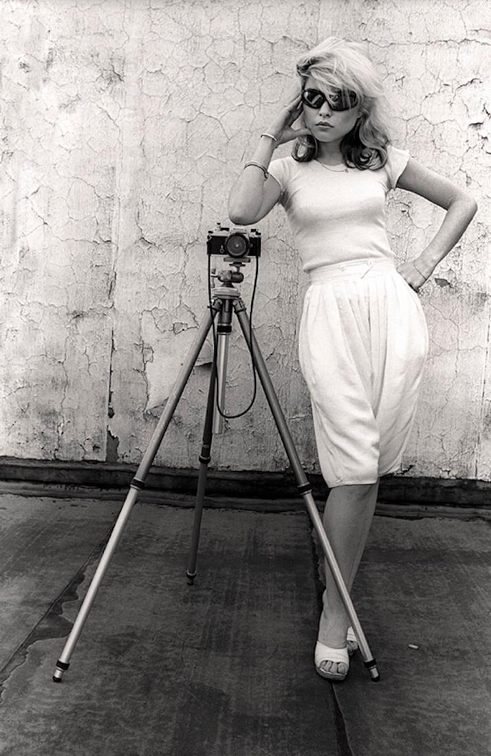 Blondie Poses by Martyn Goddard Signed Limited Edition: 1978 (printed later): Title: Blondie Poses by Martyn Goddard Signed Limited Edition: 1978 (printed later) Description: Blondie Poses Debbie Harry with a Camera on a Tripod 1978 Photo by Martyn Goddard Printed 2024. Signed