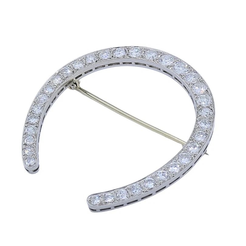 Edwardian Platinum Diamond Horseshoe Brooch: Title: Edwardian Platinum Diamond Horseshoe Brooch Description: Product details: MATERALS: Platinum EMSTONE: Diamonds WEHT: 10.7 rams MEASREMENTS: 3/16” x 1 5/8” TEM DETALS: Edwardian