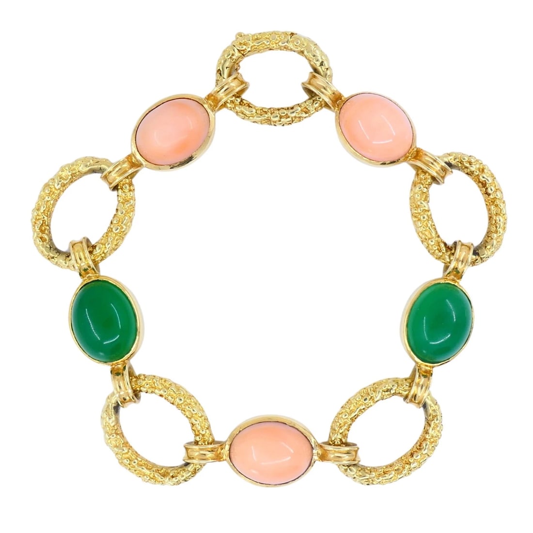 Vintage Van Cleef & Arpels 18k Gold Coral Chrysophrase Link Bracelet: Title: Vintage Van Cleef & Arpels 18k Gold Coral Chrysophrase Link Bracelet Description: This Van Cleef & Arpels bracelet from the 1990s is crafted in 18K yellow gold and set with alternating oval cab