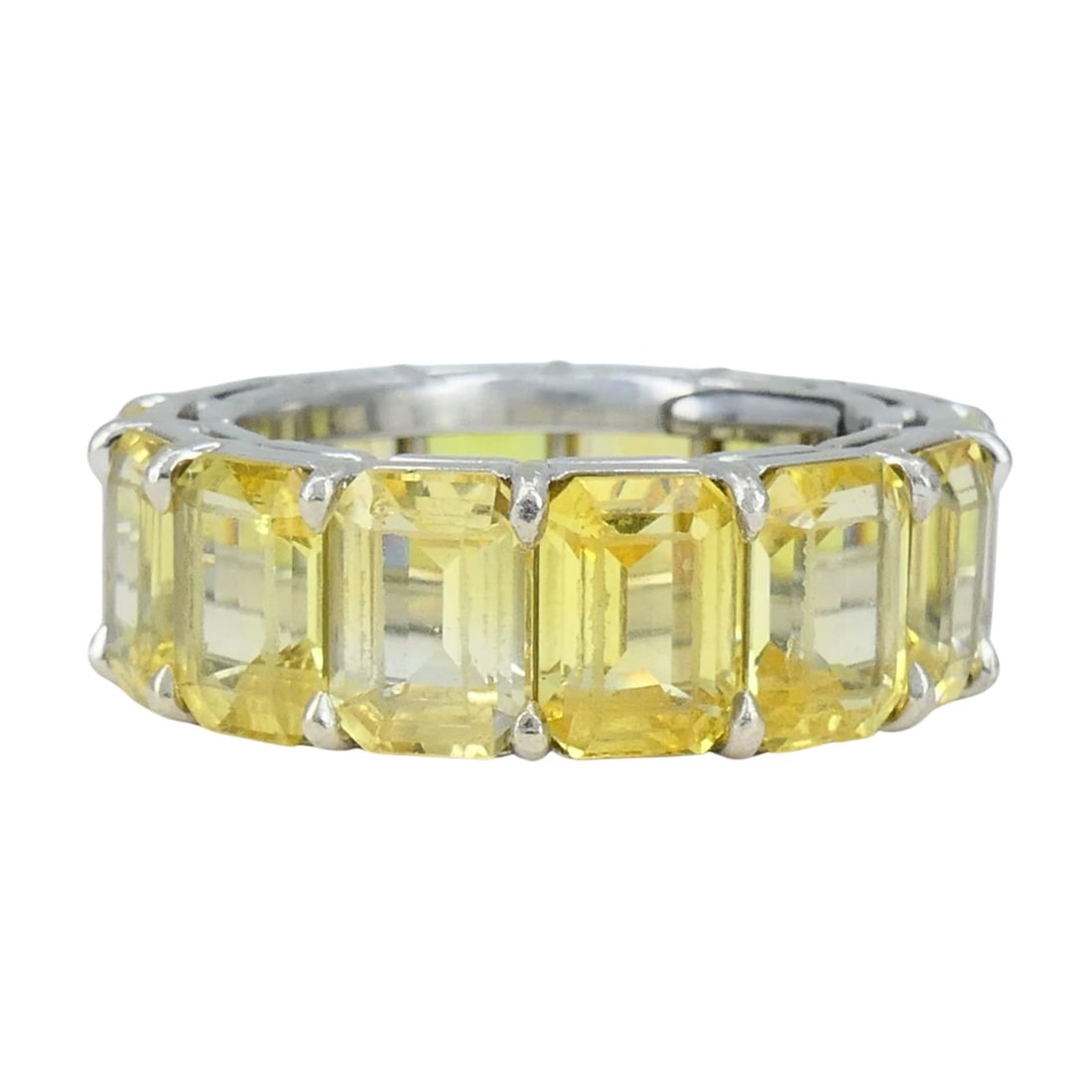 Bvlgari Yellow Sapphire Platinum Eternity Band Bulgari Ring: Title: Bvlgari Yellow Sapphire Platinum Eternity Band Bulgari Ring Description: This vintage Bvlgari eternity ring from the 1980s is crafted in platinum and set with a continuous row of emerald-cut ye