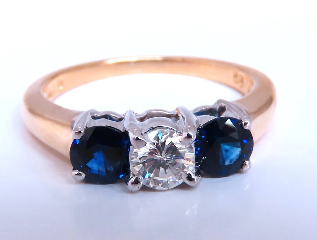 Natural Sapphire Standard Three stone diamond Ring 14kt: Title: Natural Sapphire Standard Three stone diamond Ring 14kt Description: Natural sapphire diamond ring. .76ct. Natural round blue sapphires 4.4mm blue, clean clarity and transparent. .30ct natural