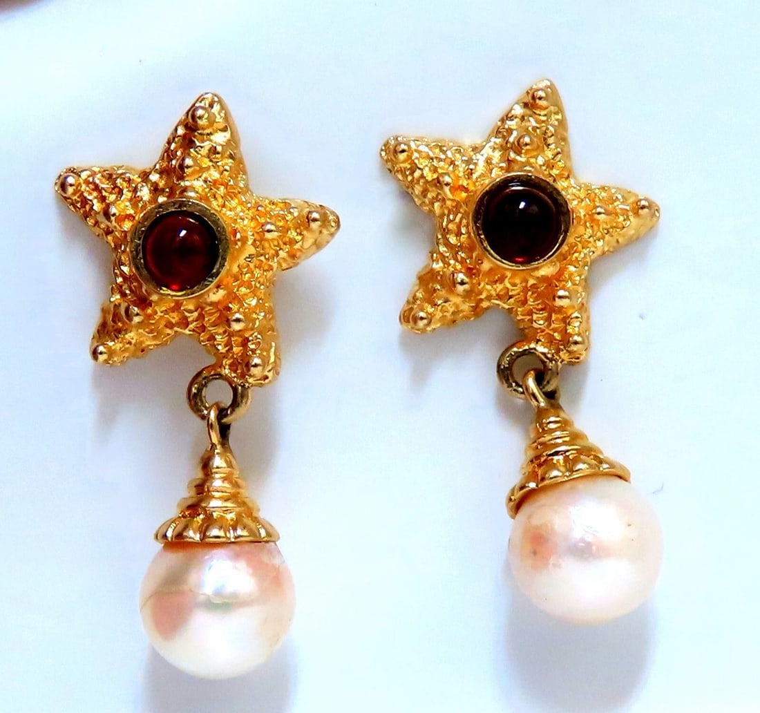 Starfish Pearl Statement Earrings 14kt**: Title: Starfish Pearl Statement Earrings 14kt** Description: Cultured Pearl clip earrings. 7mm Pearl .10ct natural garnet 14 karat yellow gold 6.8 grams Overall earrings measure 14mm wide 30mm long <b