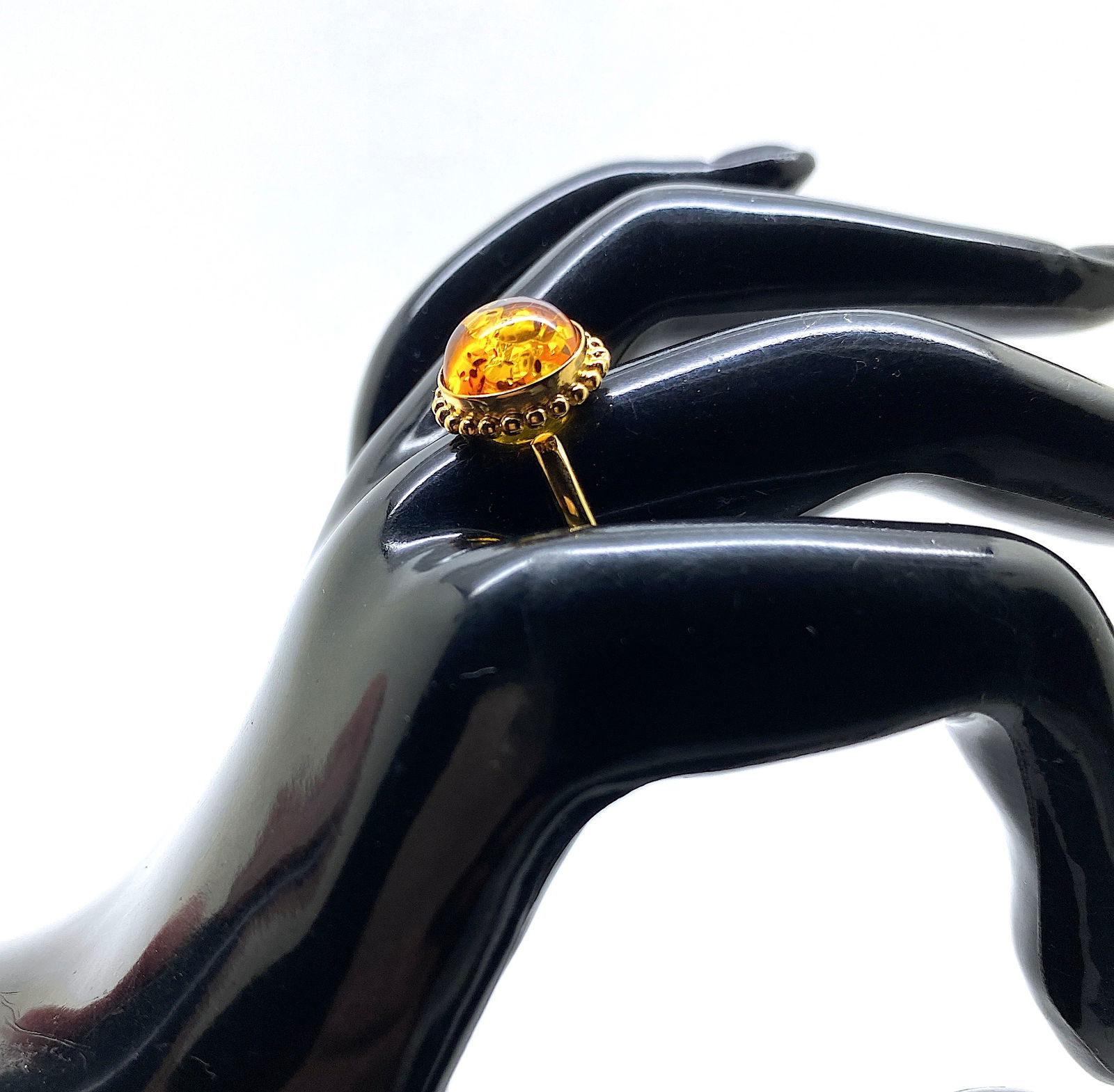 Exquisite Amber Ring: Title:Exquisite Amber Ring Metal:925 Silver-Gold Plated Gemstone:Amber Weight:3.4 g Size:Inner diameter: 19.0 x 19.0 mm Size: 27.0 x 13.0 x 21.7 mm Size: 1.063 x 0.512 x 0.854 inches Inner diameter: 0