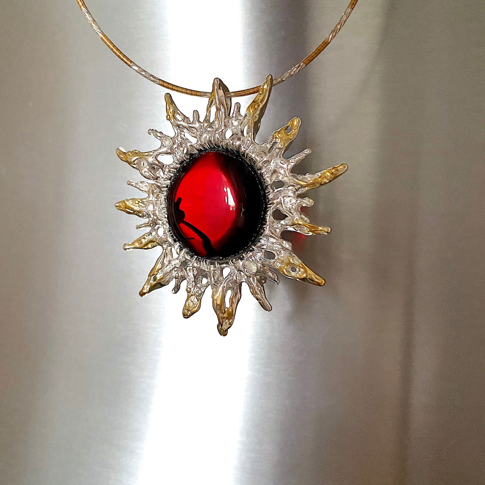 Amber Brooch / Pendant Necklace: Title:Amber Brooch / Pendant NecklaceMetal:925 Silver-Gold PlatedGemstone:AmberWeight:24.6 gSize:Size: 54.0 x 50.0 x 12.0 mm Size: 2.126 x 1.969 x 0.472 inches Made of:(Reconstituted Amber or Whole