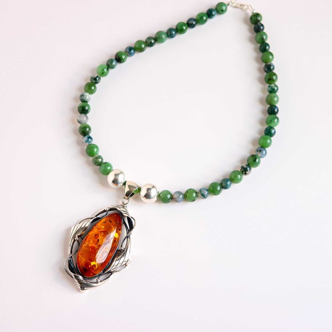 Cognac Amber Statement Necklace – Jade and Sterling Silver: Title:Cognac Amber Statement Necklace – Jade and Sterling Silver Description:Command attention with this bold natural Baltic cognac amber statement necklace, handmade by Alexis Cintron with striking