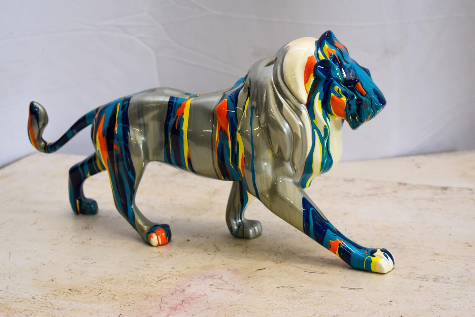 Roaming Multicolored Lion Resin Statue 19" x 5" x 9"H - 9