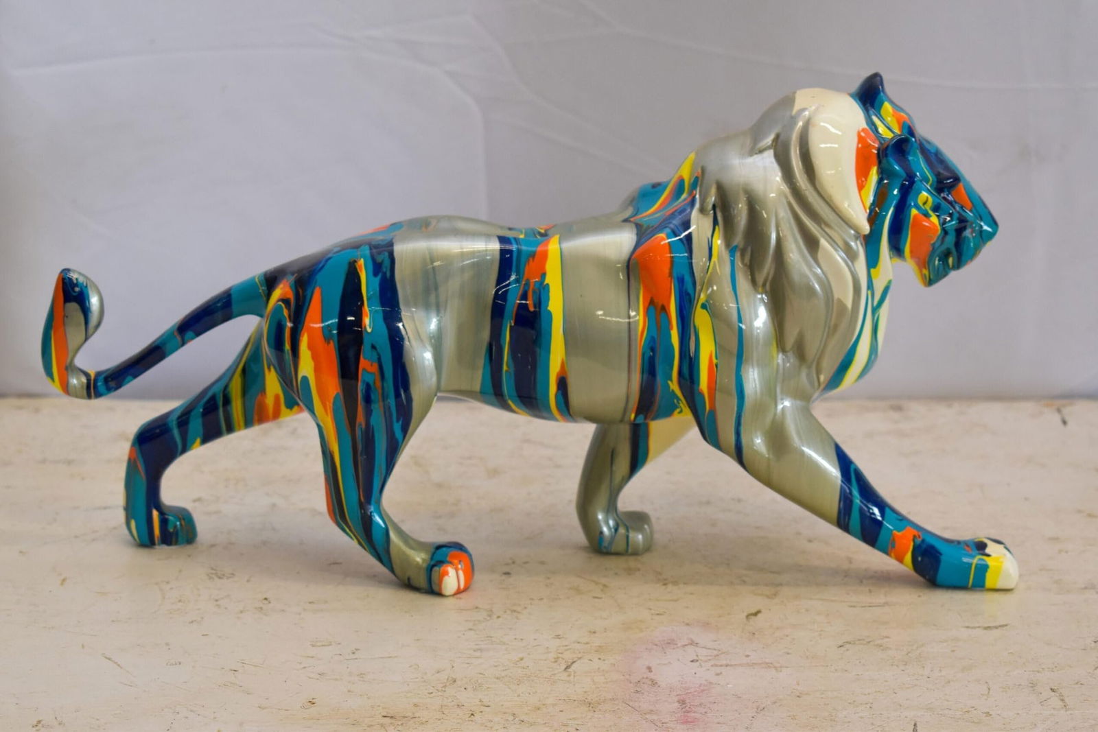 Roaming Multicolored Lion Resin Statue 19" x 5" x 9"H - 10