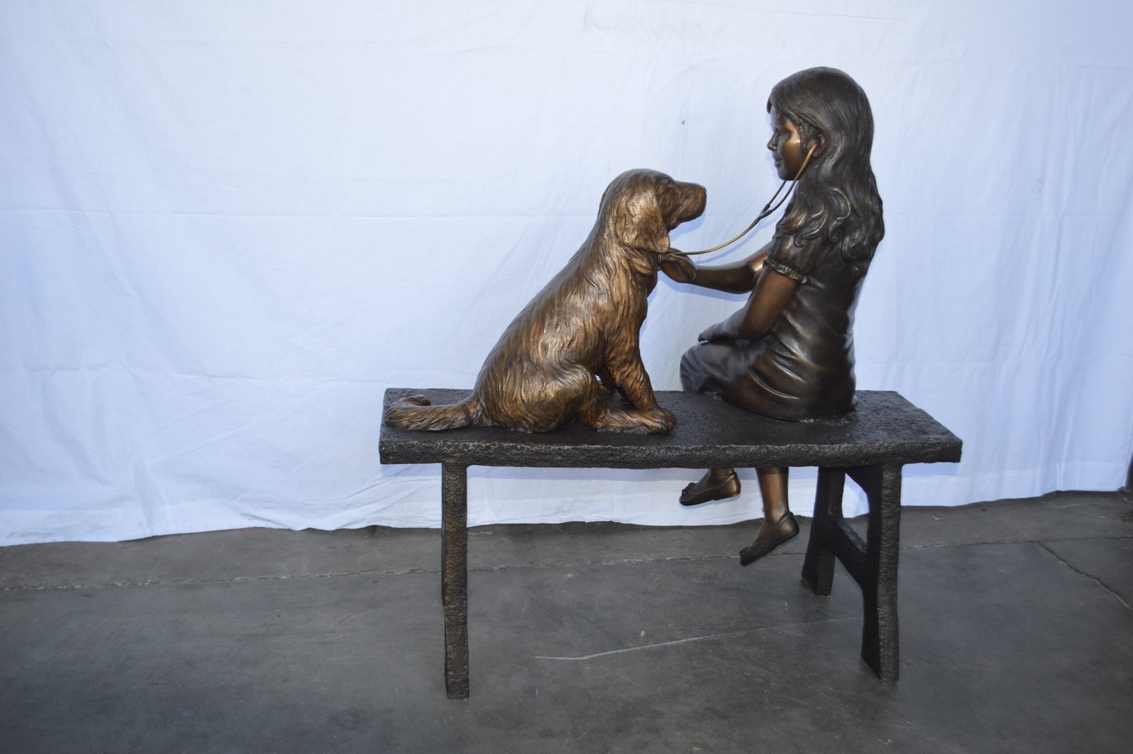 Girl plays Doctor on a Bench W Dog Bronze Statue - Size: 38"L x 18"W x 39"H. - 11