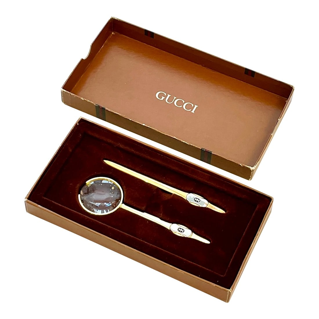 Late 20th Century Vintage Gucci Desk Accessory Set- 2 Pieces: Classic Vintage Late 20th Century Desk Set with Letter Opener and Magnifying Glass by Gucci in its original box. Condition: Alterations: Original Condition Unaltered Imperfections: Some Imperfections