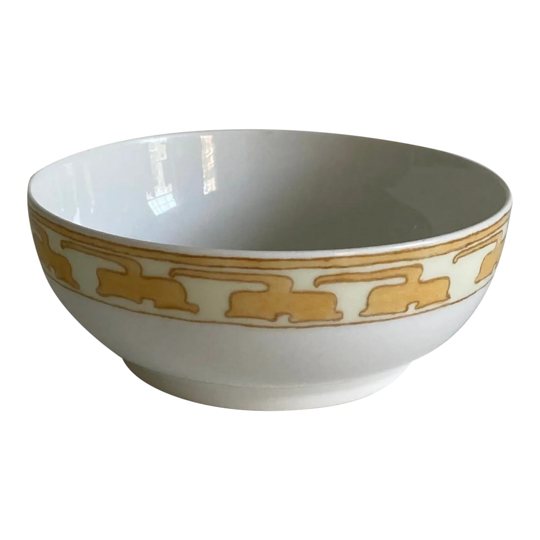 Circa 1905 Tressemanes & Vogt Art Nouveau French Limoges Hand Painted Porcelain Decorative Bowl: An early 20th century, French Limoges porcelain bowl with a hand painted exterior design in an art nouveau floral pattern in a muted mustard yellow, gold, and ivory colors on a white, porcelain backgr