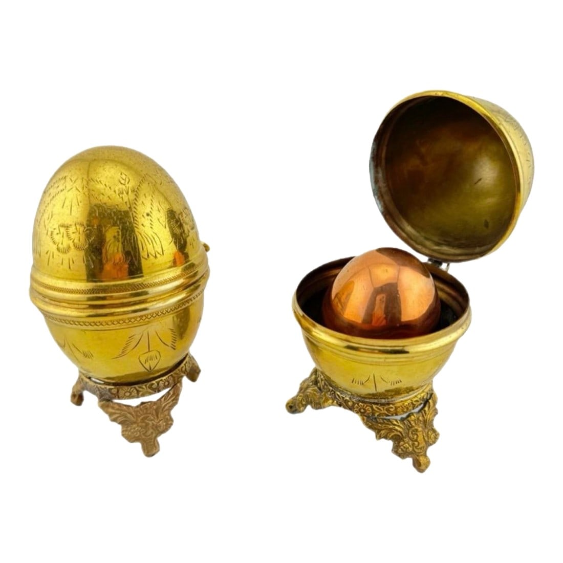 Vintage Brass Egg Boxes - Set of 3: Vintage Brass Egg Boxes Set of 3 vintage eggs from India. One of the eggs is copper and the other 2 are brass. The brass eggs have a hinge opening and ornate etchings. The copper egg does not open, bu