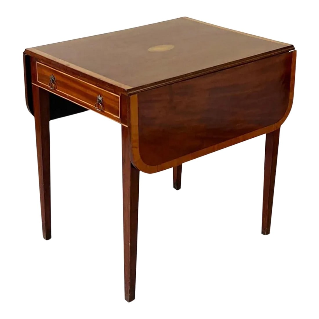 Federal Mahogany Inlaid Pembroke Table: A Federal mahogany drop-leaf Pembroke table with satinwood line and shell inlay, a single drawer, and tapering legs. 27-1/2in tall x 28in wide x 21 in deep. Condition: Alterations: Original Condition