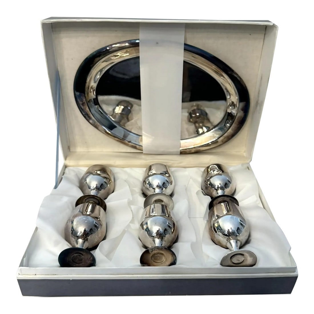 Mid 20th Century Brandy Snifter Set - Set of 7: Silverplate brandy snifter set with 6 cups (2.5" x 1.5") and a tray (8.5" x 6"). New in box. Signed, "MET" on underside Condition: Alterations: Original Condition Unaltered Imperfections: Some Imperfe